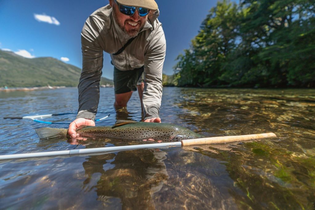 Angler selecting the ideal Tenkara rod for fishing in a clear mountain stream