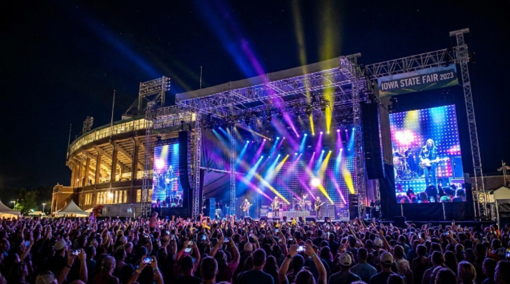 Iowa State Fair Grandstand concert stage lit up at night with a full audience in attendance