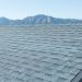 High winds lifting asphalt shingles on a Denver roof